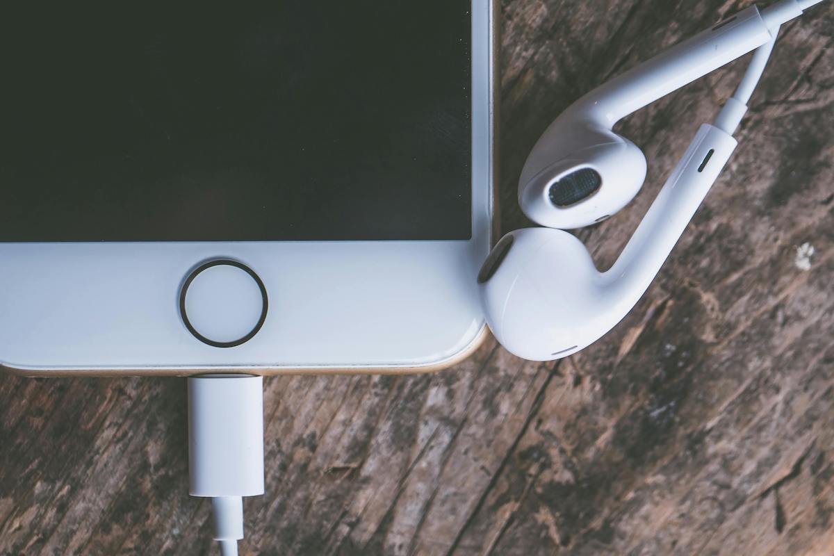 Closeup Photography of Iphone and Earpods