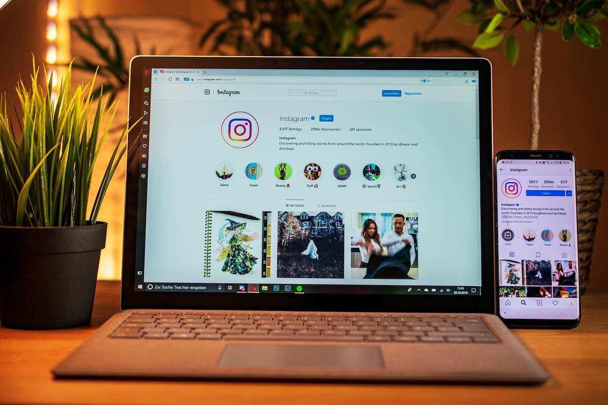 A laptop and iphone with instagram visual content