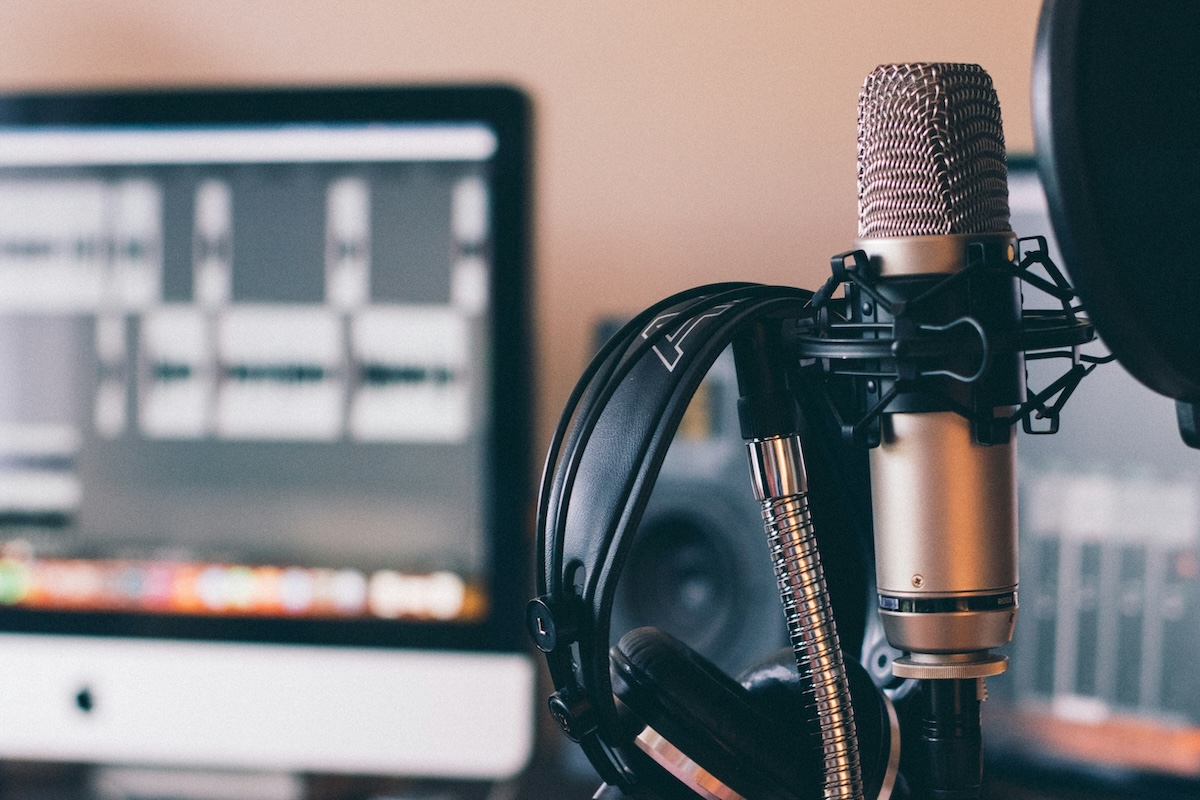 Podcast recording set up with microphone and headphones