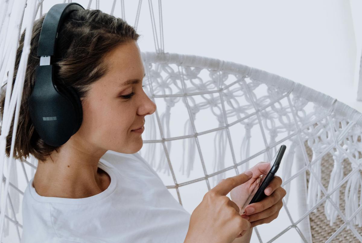 Woman listening to spotify podcast