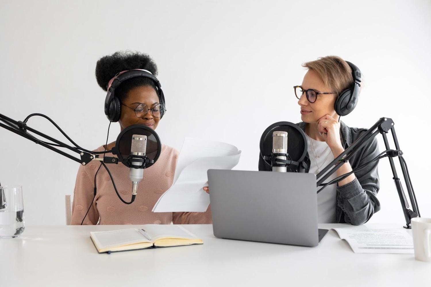 Image of podcasters recording an episode in a studio