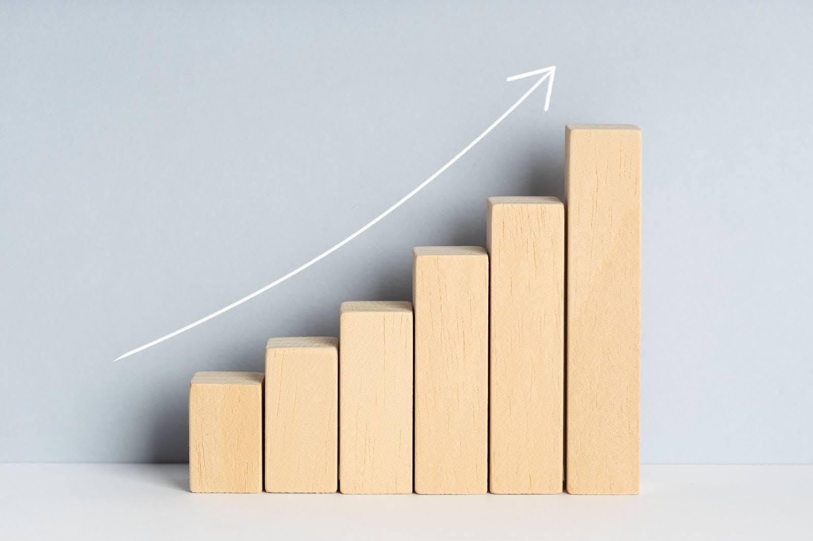 Wooden blocks representing an upward trend graph