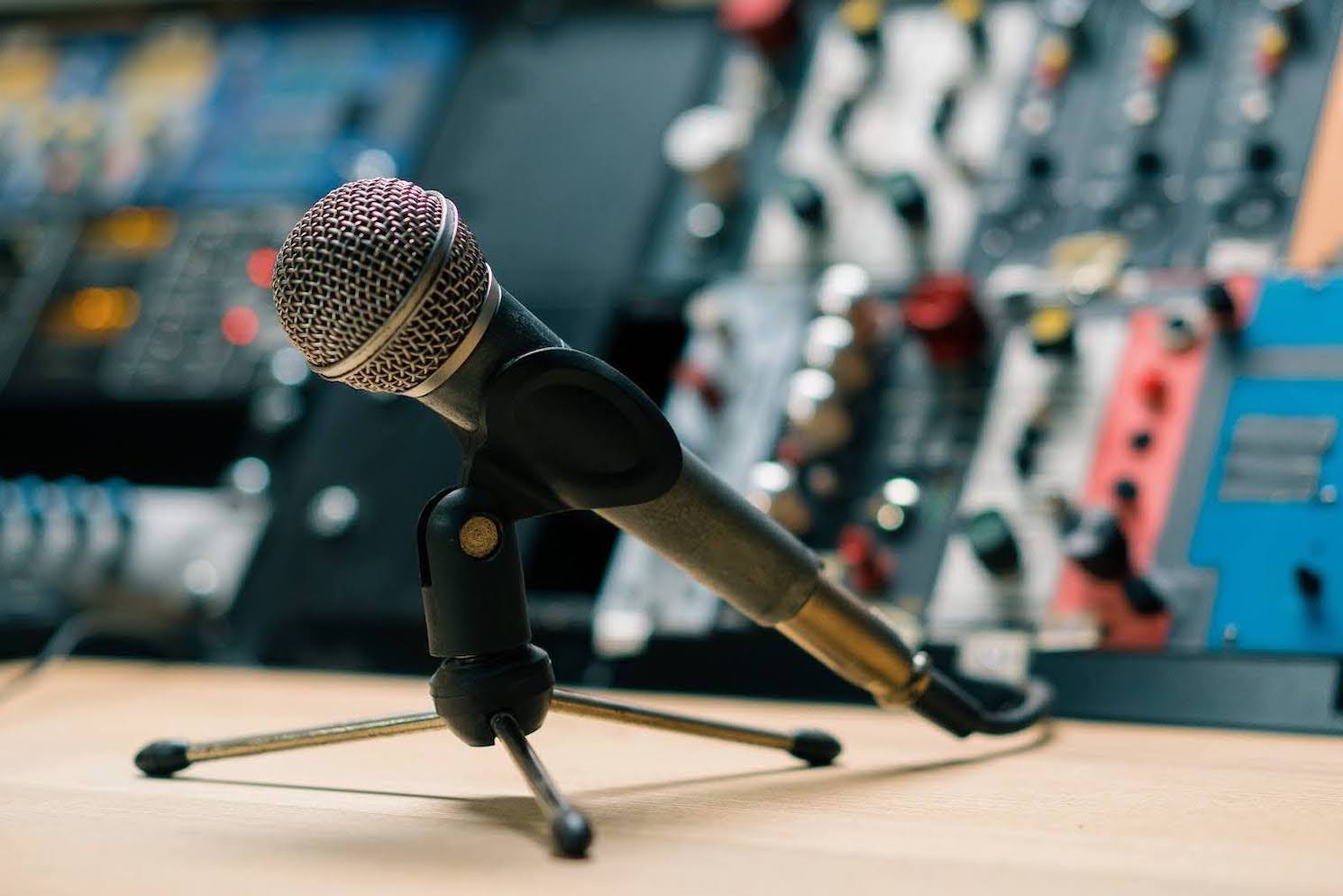 Dynamic microphone mounted on a table in a recording studio