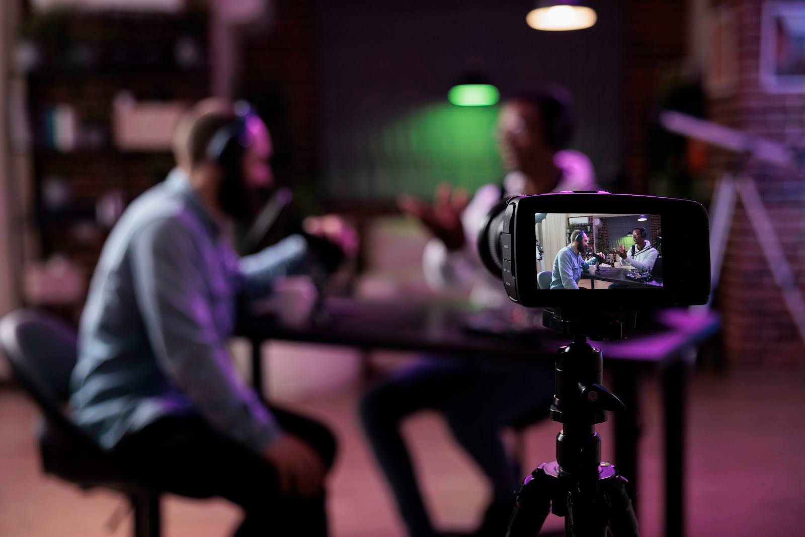 Image of a DSLR camera recording a podcast episode. 